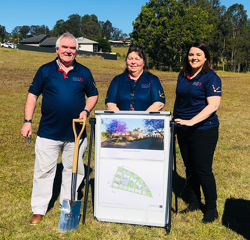 Image of North Coast Community housing staff with housing plans