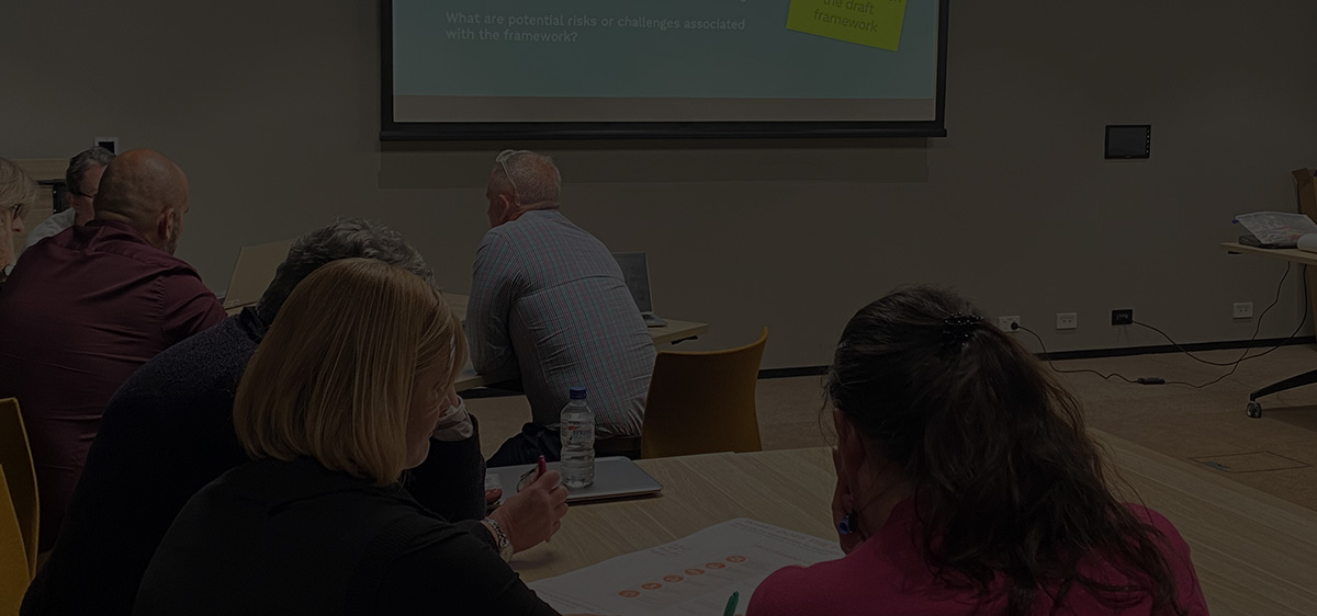 Dark image of workshop attendees