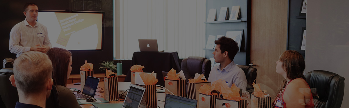 Header image showing students in training room